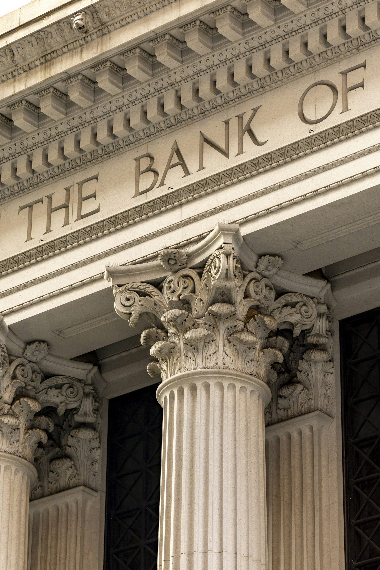 Carved bank lettering and stone columns on a classical facade